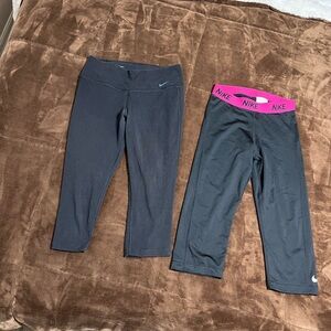 2 pairs of woman’s size medium Nike cropped leggings